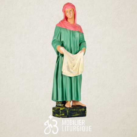 Personnage de crèche : Paysanne tenant du linge, en plâtre coloré