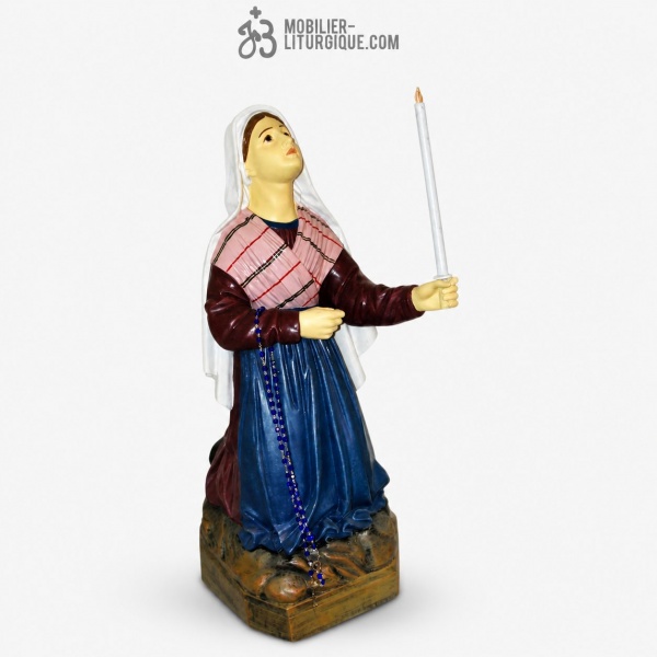 Statue de Sainte Bernadette tenant une bougie